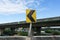 Yellow curve warning sign on side of express high way