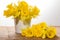 Yellow dafodills in white bucket