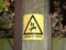 yellow danger of death safety sign outside pole electricity shoc