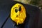 Yellow, deflated, birthday balloon. angry face