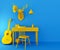 Yellow desk and chair on blue background. Composition with table, guitar, ball, decorative deer head and baseball cap.