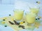 Yellow dessert Junket from milk and rennet extract with turmeric in glasses on light background. Jelly-like pudding made from swee