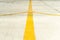 Yellow direction strips closeup on an airfield runway.