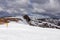 Yellow directional path mark in form of arrow buried in deep snow near Ladinger Spitz, Saualpe, Carinthia, Styria, Austria