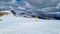 Yellow directional path mark in form of arrow buried in deep snow near Ladinger Spitz, Saualpe, Carinthia, Styria, Austria