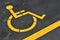 Yellow disabled people parking sign