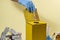 Yellow disposal box for contaminated or infectious products in a hospital or home