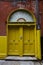 A yellow door in Dublin, Ireland. Arched Georgian door house front