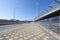 Yellow dots on wide pedestrian bridge