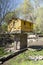 Yellow dovecote birds house is set on a high pole in the city for public breeding of pigeons