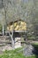 Yellow dovecote birds house is set on a high pole in the city for public breeding of pigeons in the park of the pines