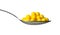 Yellow dragee with vitamins in spoon isolated