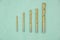 Yellow drill bits on a blue paper background isolated.