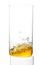 yellow drink - juice, cider, tea or kombucha - pouring into transparent glass isolated over white background. healthy