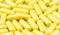 Yellow drug capsules macro