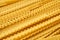 Yellow dry mafaldine pasta background