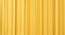 Yellow dry mafaldine pasta background