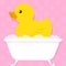 Yellow duck in bathtub with bubbles