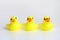 Yellow duck toy on white background. Business, Leadership, Teamwork or Friendship Concept