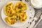 Yellow dumplings with turmeric, fried onions and parsley