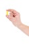 Yellow ear plug in male hand