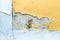 yellow erode painted concrete wall,grunge rough texture background