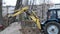yellow excavator bucket aka scoop grab the ground, rescue technology, agrimotor aka tractor arm cover the firetrench, industry,
