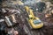 Yellow excavator digging on construction site