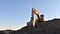 Yellow excavator during earthmoving at open pit on blue sky background. Construction machinery and earth-moving heavy equipment