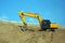 Yellow excavator, excavation work at a