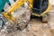 yellow excavator or macro truck working in house construction site separate garbage on soil