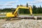 Yellow excavator in the road building