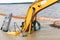 Yellow excavatorconstruction equipment drowned on the lake while working to strengthen the shore. Safety violation