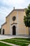 Yellow facade of the catholic St. Stephen`s Cathedral in Shkoder Albania.  Grand Church against the backdrop of a cloudy sky -