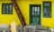 Yellow facade with green door and windows Romania