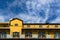 Yellow facade with rows of balconies