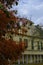 Yellow facade of the Villa Casino dei Boschi across the red plants tree. Boschi di Carrega, Emilia-Romagna, Italy