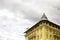 Yellow fancy building on cloudy sky background