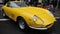 Yellow Ferrari 275 , front-engined V12-powered grand touring automobile with two-seater coupÃ© and spider body produced by Ferra