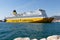 A yellow ferry from the company Corsica ferries in the port of Toulon makes connections with Corsica by crossing the