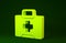 Yellow First aid kit icon isolated on green background. Medical box with cross. Medical equipment for emergency
