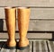 Yellow Fisherman Galoshes wellington boots on a wooden floor