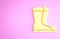 Yellow Fishing boots icon isolated on pink background. Waterproof rubber boot. Gumboots for rainy weather, fishing