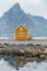 A yellow fishing cabin in SakrisÃ¸y, Norway