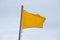 Yellow flag on the beach