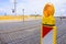 Yellow flashing light standing at road construction site. Road works concept.