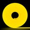 Yellow flexible glowing led tape neon in reel standing on black background