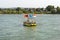 A yellow floating platform on the river with inland prohibitory and mandatory signs.