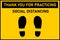 Yellow floor sticker sign with Thank you for practicing social distancing, foot shape on yellow. Signage for customer information