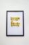 Yellow floral text outline in black wall picture frame